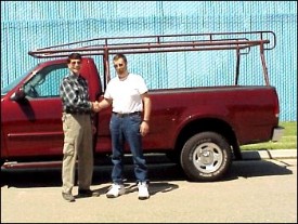 CalRack.com GM Chris Green (left) greets Emery Koval (right) after his 2,100 mile odyssey.